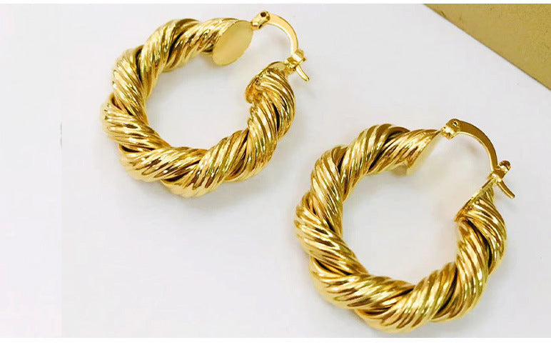 Boucle d`oreilles torsadé en or